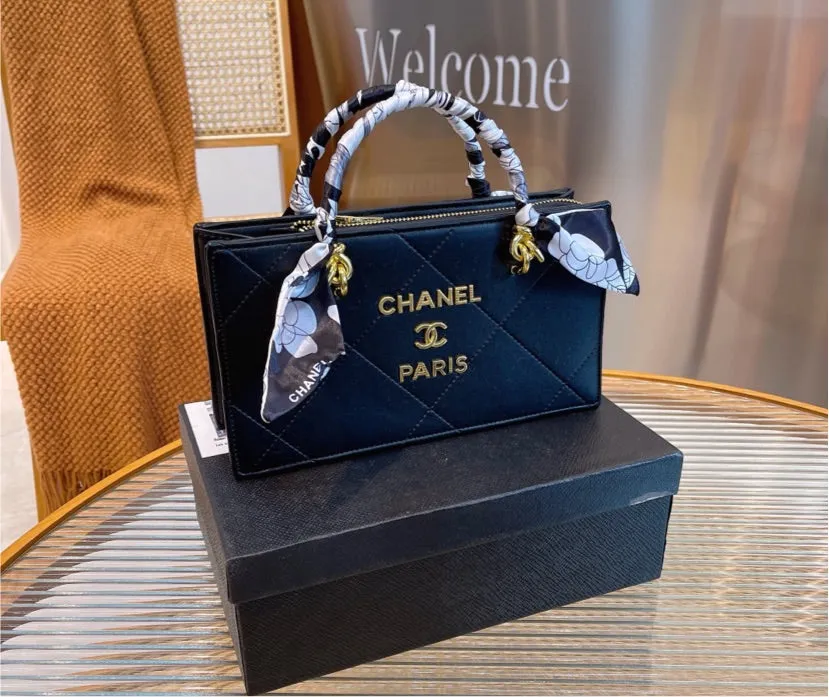 Black Chanel woman handbag